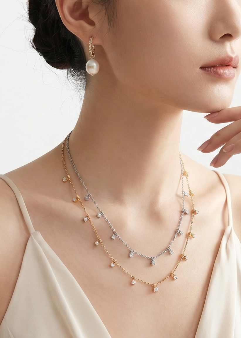 Woman wearing a necklace and earrings on a plain background